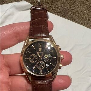 Poedagar watch. Stainless steel back. Water resistant. Brown leather strap